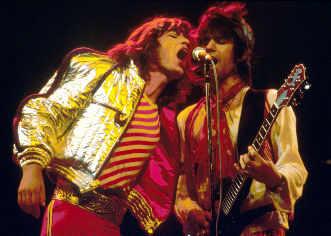 Mick Jagger and Keith Richards performing on stage.