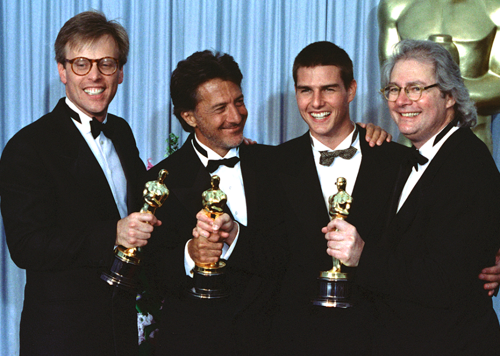 Mark Johnson, Dustin Hoffman, Tom Cruise, and Barry Levinson pose with ‘Rain Man’ Oscars.