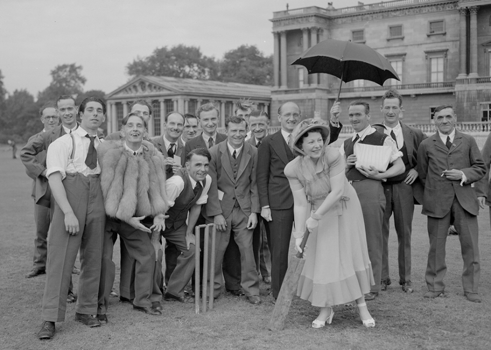 Singer Margaret Eaves playing cricket with veterans at the Not Forgotten Association Garden Party in 1948.