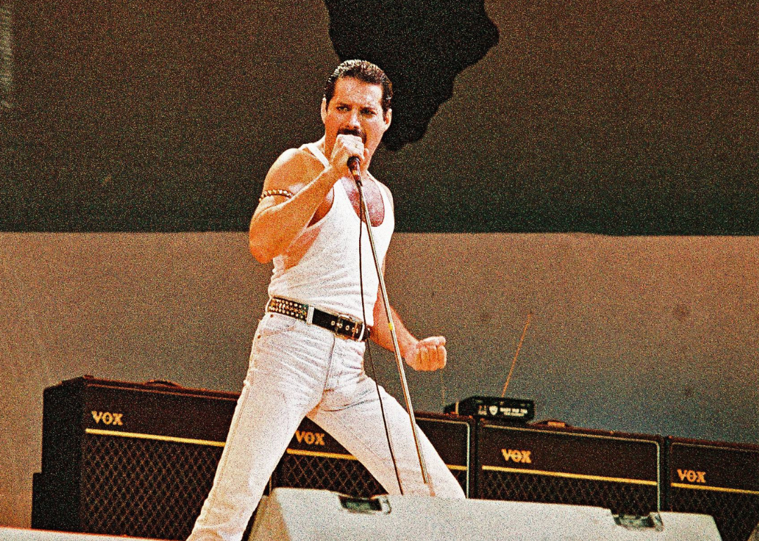 Freddie Mercury performs onstage at Live Aid.
