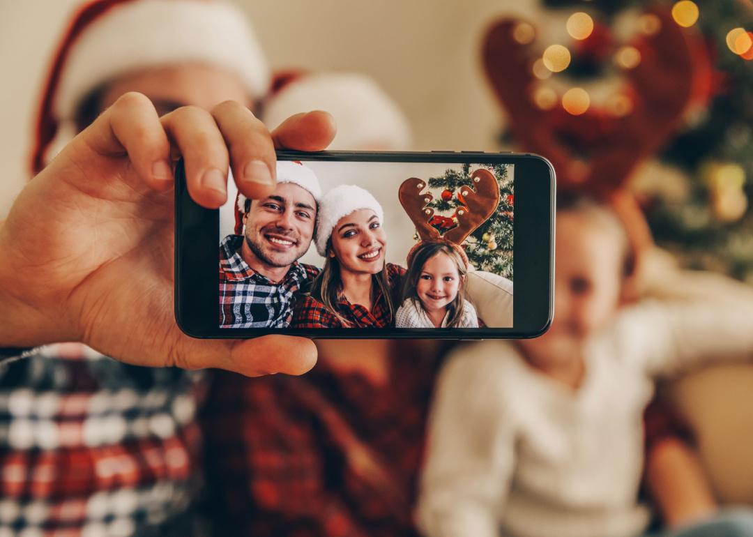 Family taking selfie at Christmas.