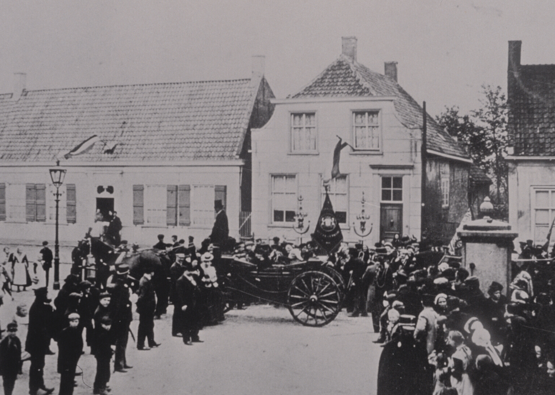 Vincent van Gogh's house with people gathered in front at Groot Zundert in the Netherlands.