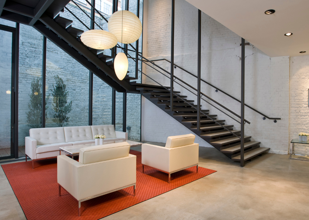 Knoll showroom with Florence Knoll Sofa, table and chairs and Noguchi Akari lamps.