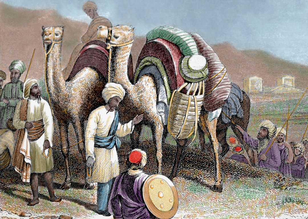 Engraving depicting a caravan of traders and camels on the silk road.