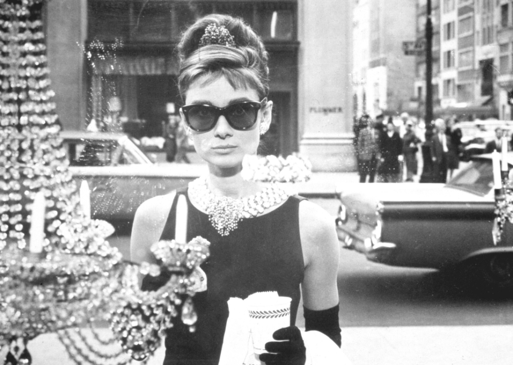Audrey Hepburn looks into a window a Tiffany’s in a still from the film ‘Breakfast at Tiffany’s.’