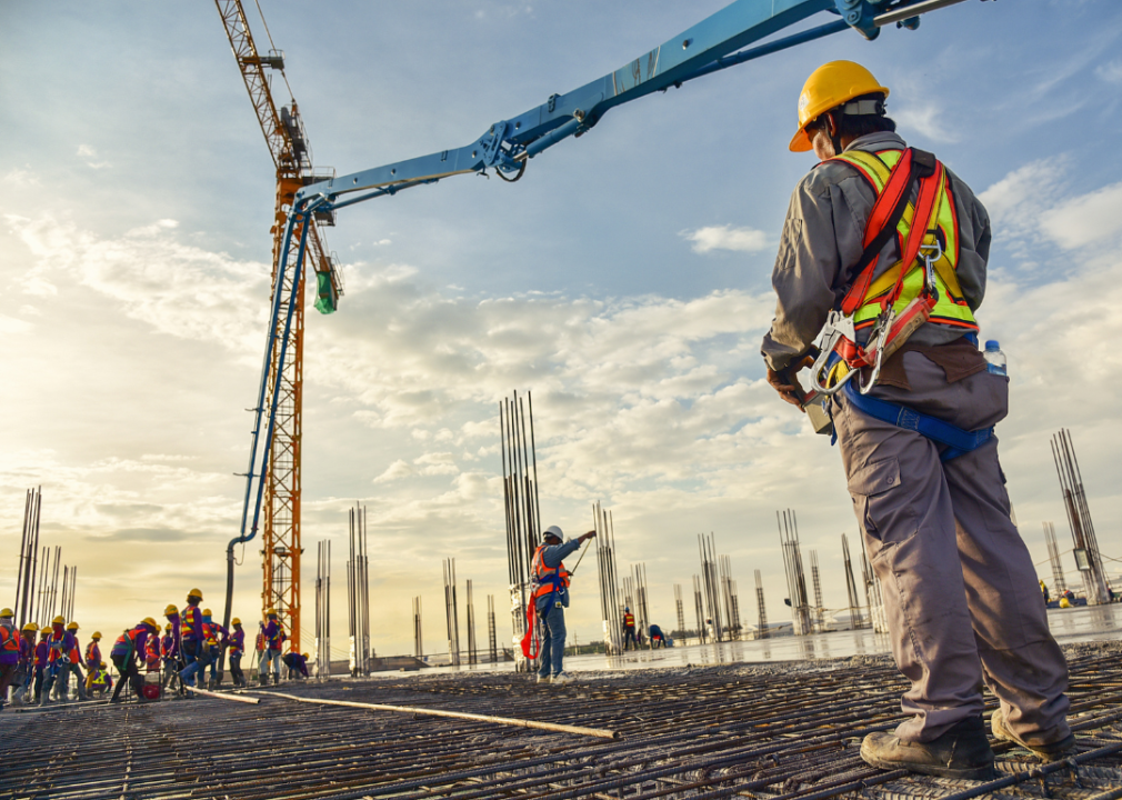 Construction workers pouring concrete