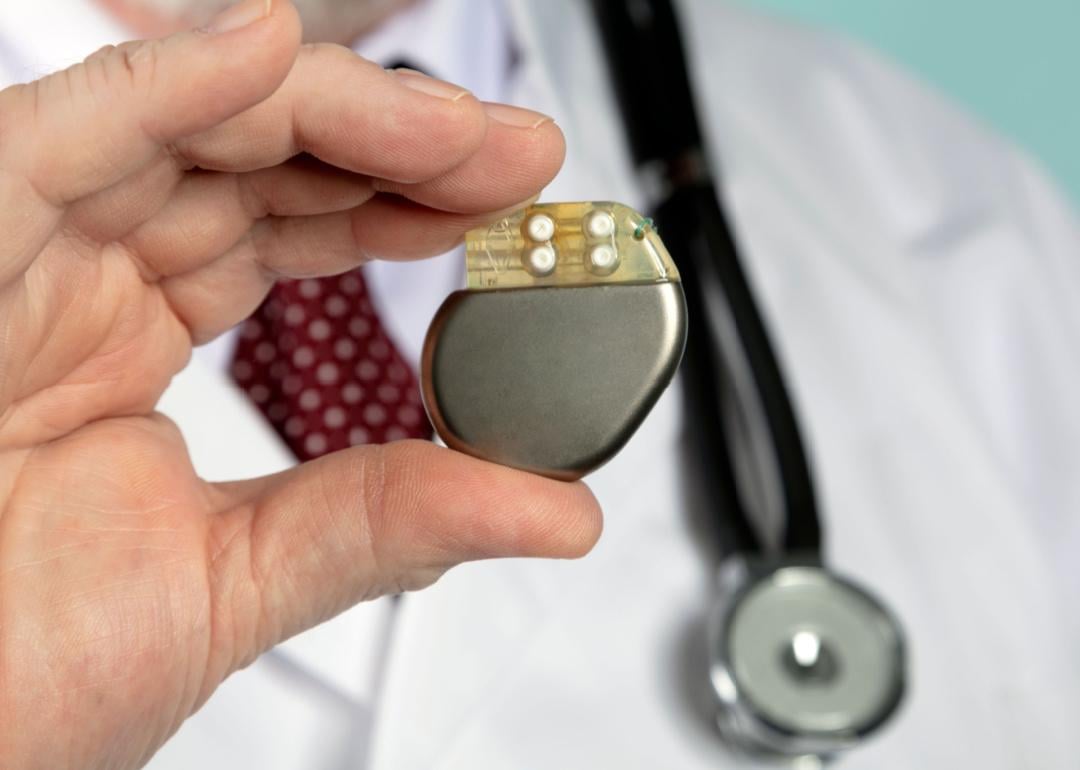 Close up of doctor holding pacemaker