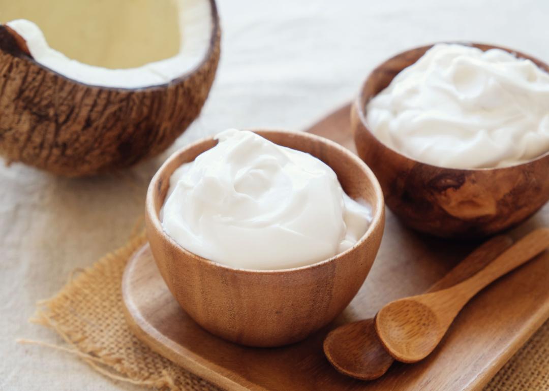 Organic coconut yogurt in wooden bowl.
