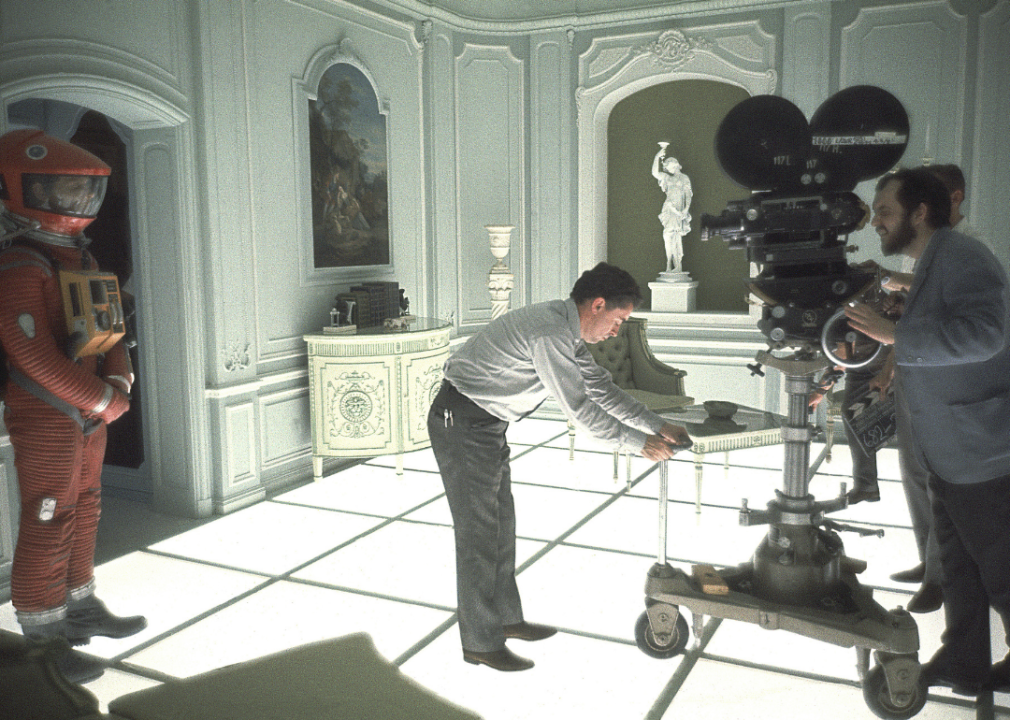 John Alcott adjusts the camera while Stanley Kubrick looks through the lens on the set of ‘2001: A Space Odyssey’.