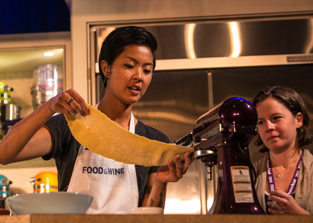 Kristen Kish conducts a cooking demonstration.