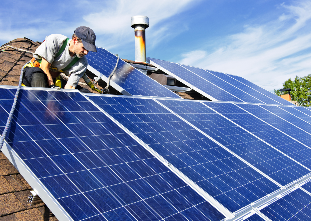 Man installing photovoltaic panels