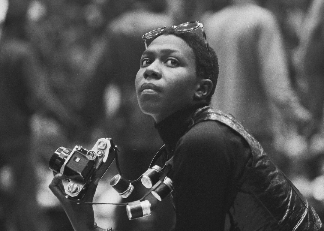 Afeni Shakur holds a camera as she attends a session of the Revolutionary People