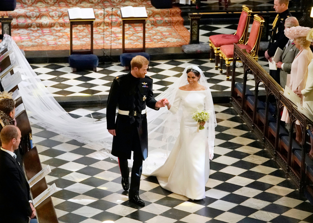 Prince Harry and Meghan Markle walk down the aisle after their wedding ceremony in St George