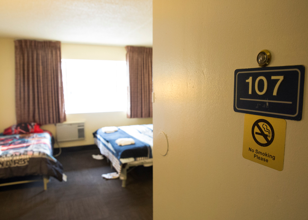 Open door to room at a hotel that serves as a temporary shelter for homeless