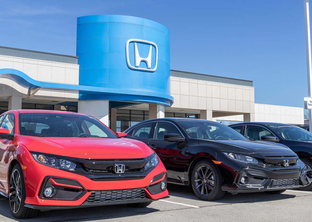 Hondas parked at a dealership.
