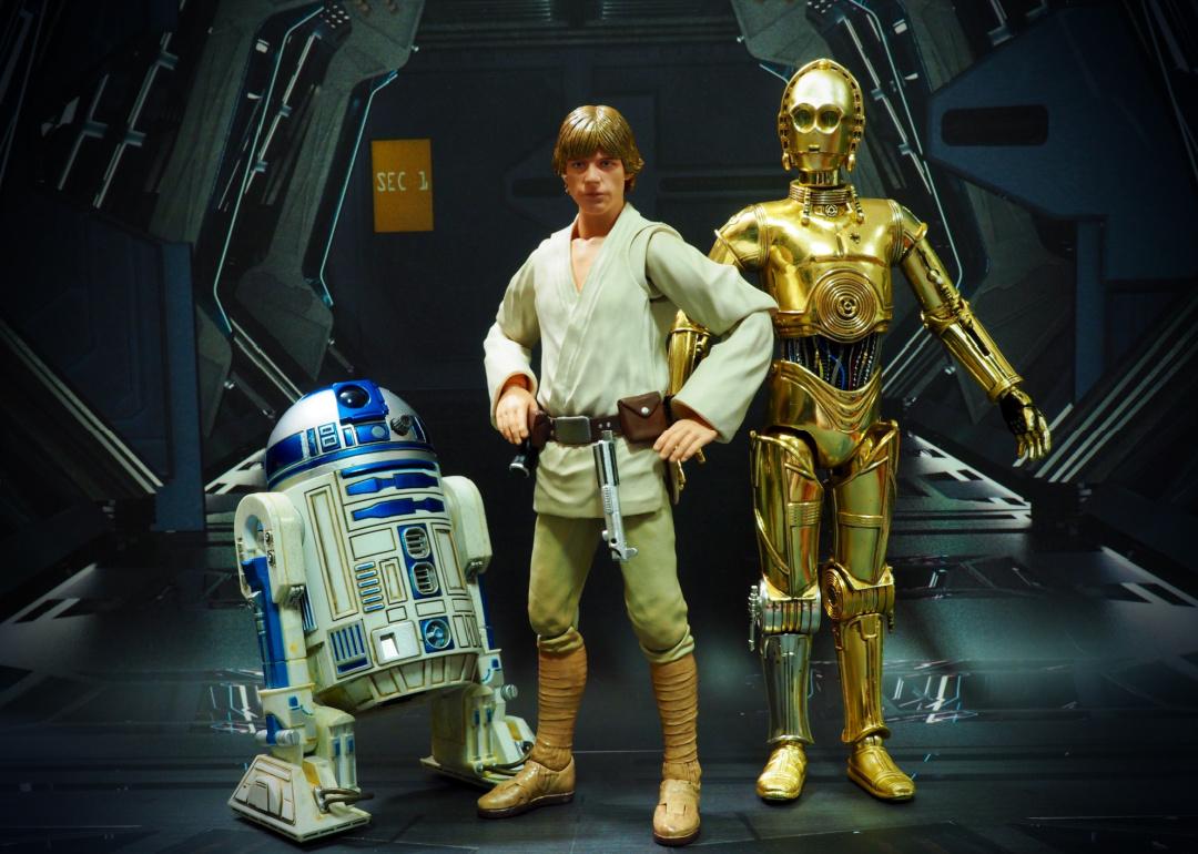 A display of Star Wars action figures: R2-D2, Hans Solo and C-3PO.