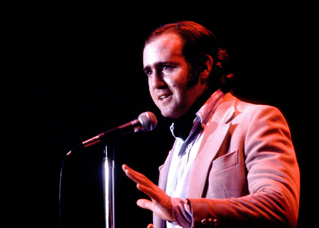 Andy Kaufman performing onstage.