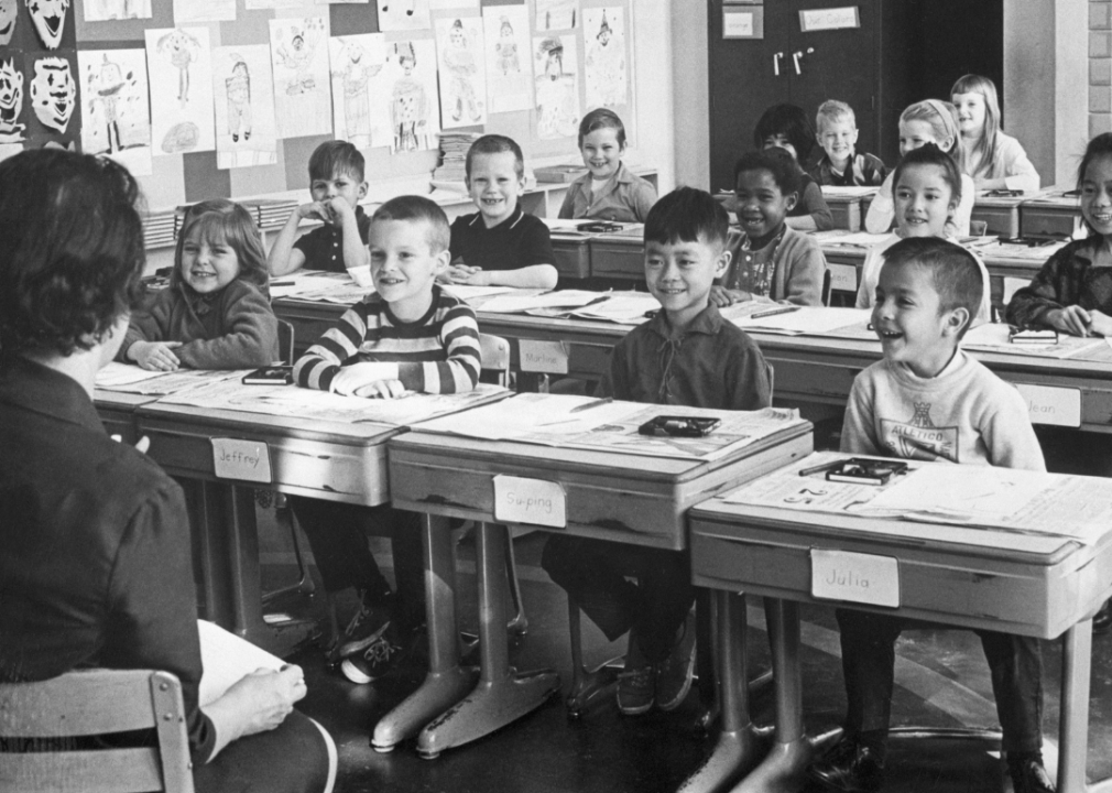 Smiling first grade students in classroom.