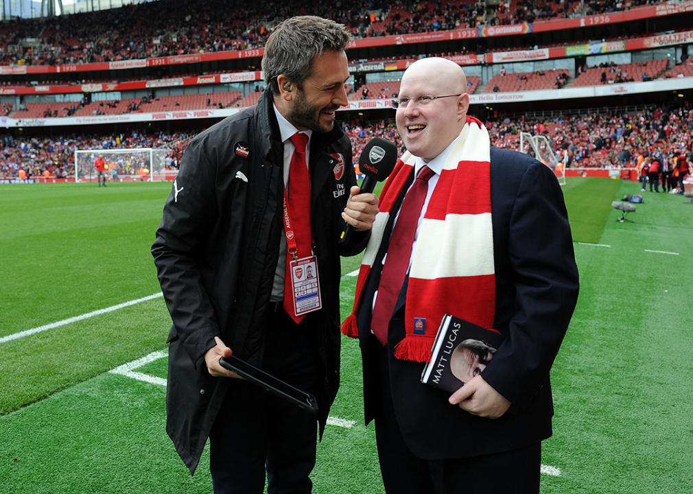Matt Lucas is interviewed by Nigel Mitchell at a Premiere League Arsenal match.