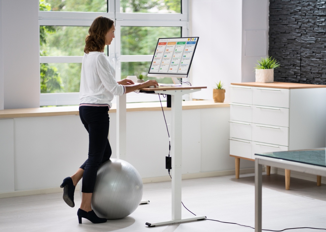 Person at adjustable height standing desk.