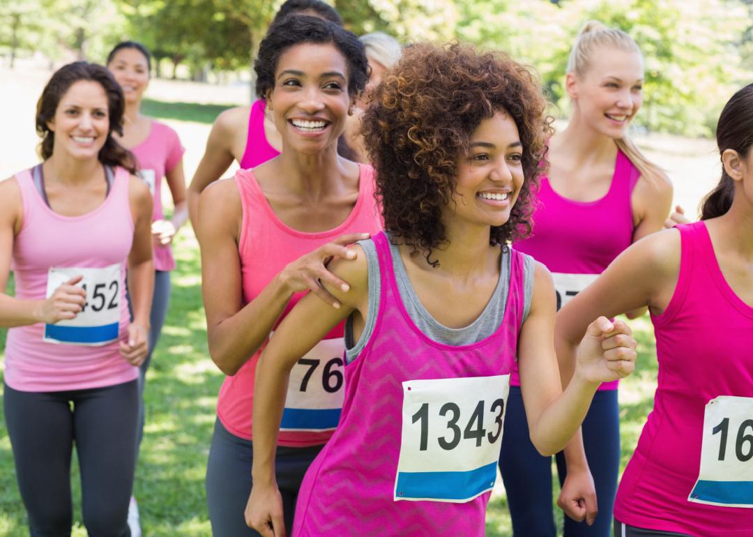 Participants of charity marathon gathered in park.