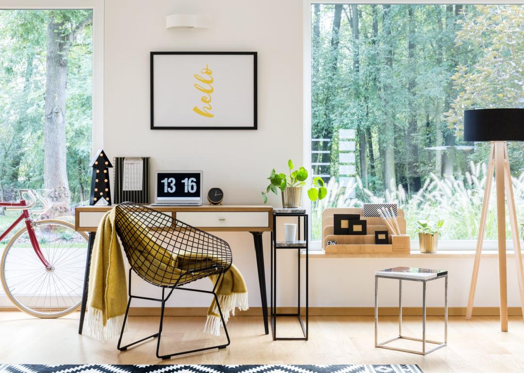 Modern working space filled with natural light and forest view.