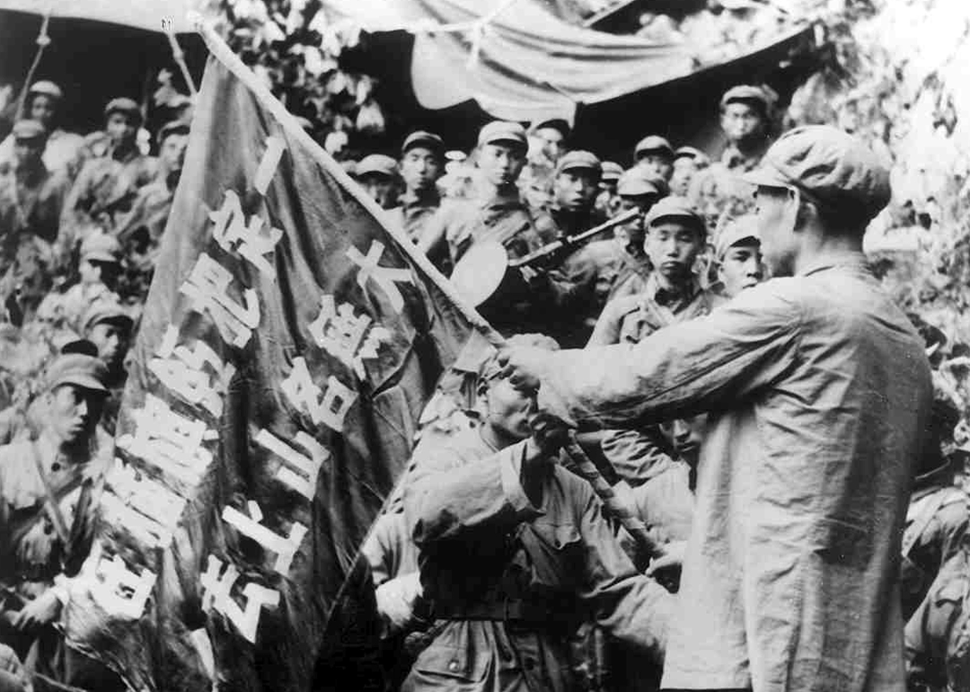 Chinese People's Volunteer Army holding flag in North Korea