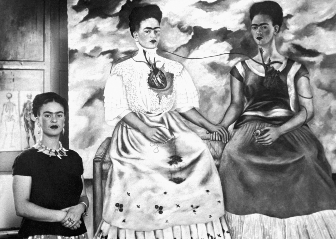 Frida Kahlo with the self portrait ‘Me Twice.’