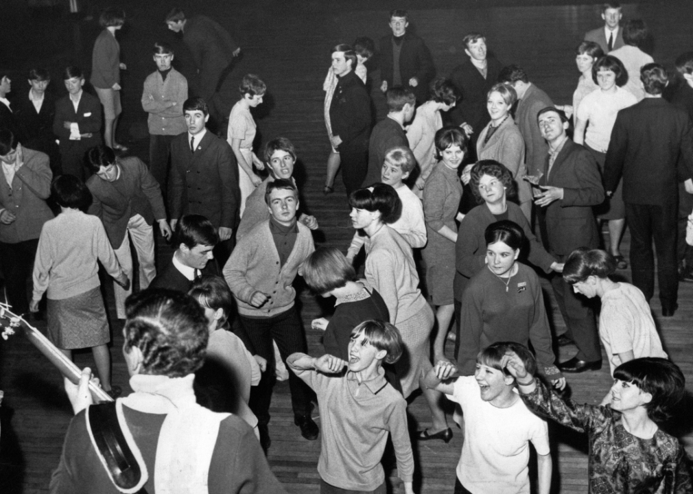 Teenagers dancing the twist at a dancehall.