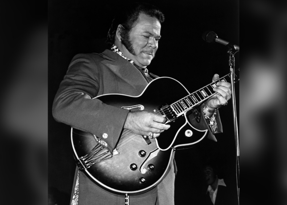 Roy Clark performing onstage.