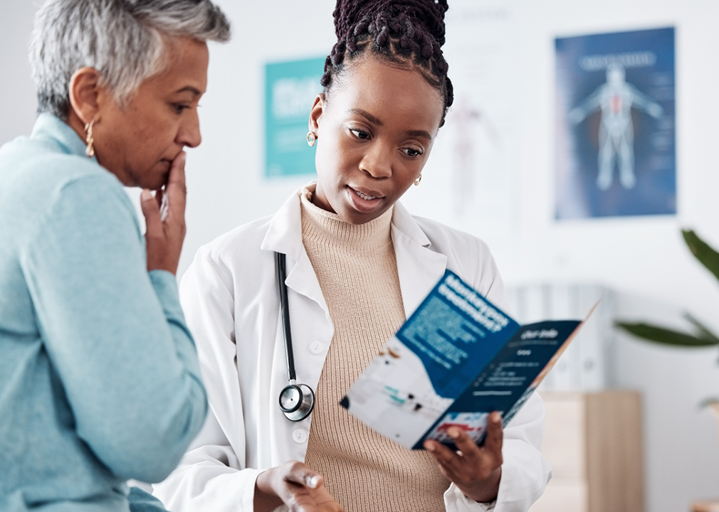 Older Black patient discussing health care with doctor.