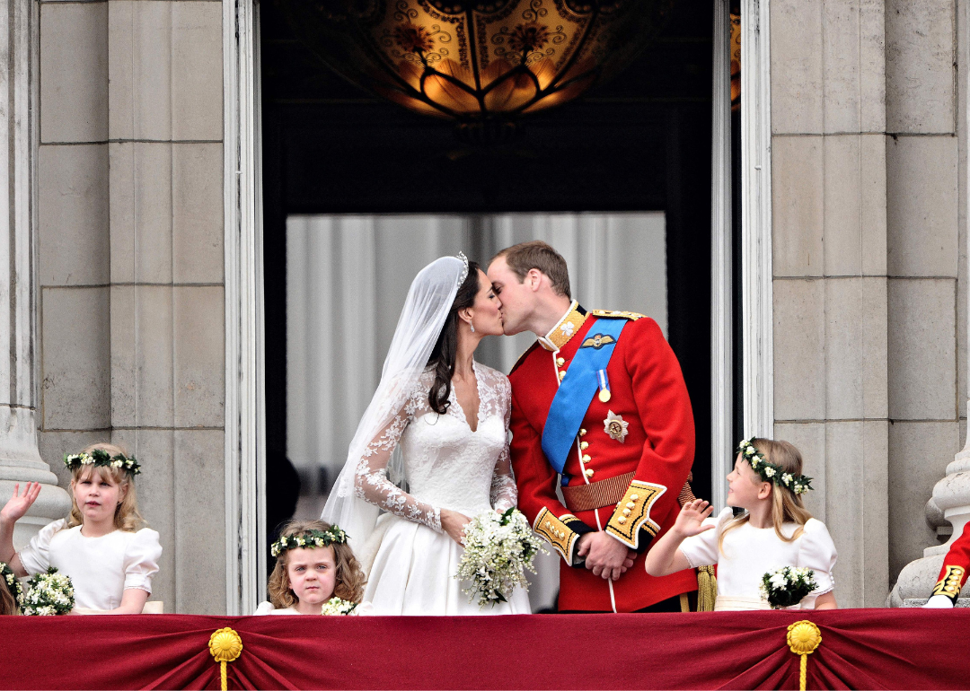 Prince William kisses his wife Kate on the balcony of Buckingham Palace