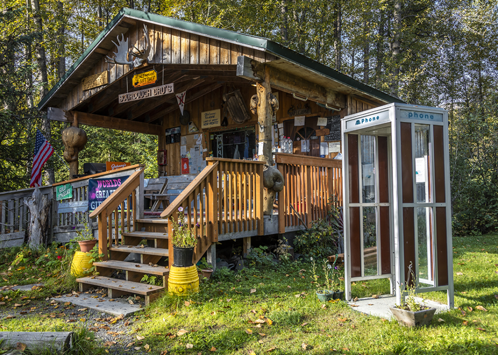 Sourdough Dru's Alaskan cabin with telephone booth.
