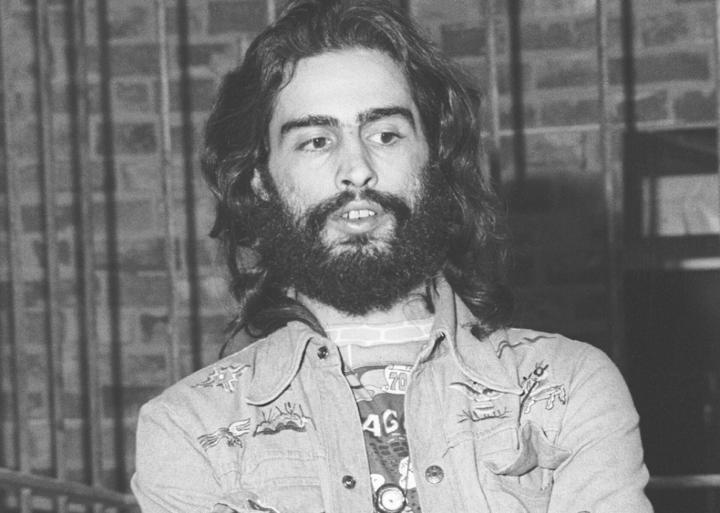 David Mancuso stands by brick wall