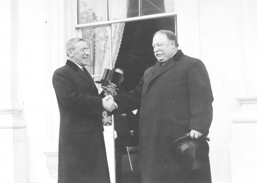 Incumbent Taft congratulates incoming president Wilson at inauguration.