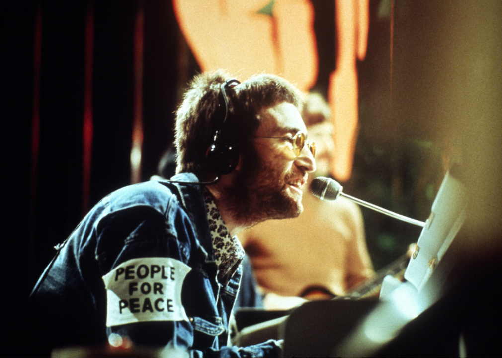 John Lennon performing at piano