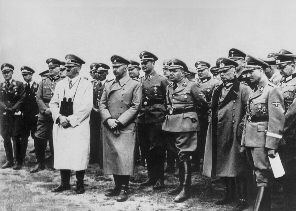 Nazi leader Adolf Hitler stands with Heinrich Himmler and staff while looking across the English Channel from Calais in August 1940.