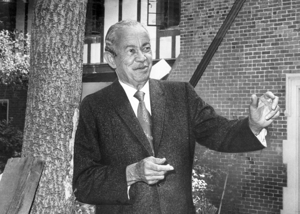 Paul Revere Williams stands before a Tudor mansion in Bel Air.