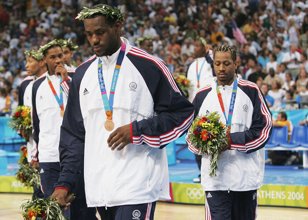 LeBron James, Carmelo Anthony, and Allen Iverson walk off the court after they receive the bronze medal.