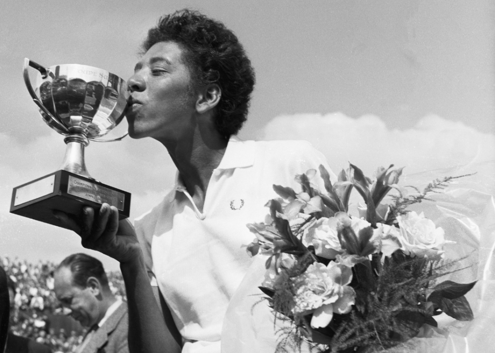Althea Gibson kisses the trophy cup after having won the French International Tennis Championships in Paris.