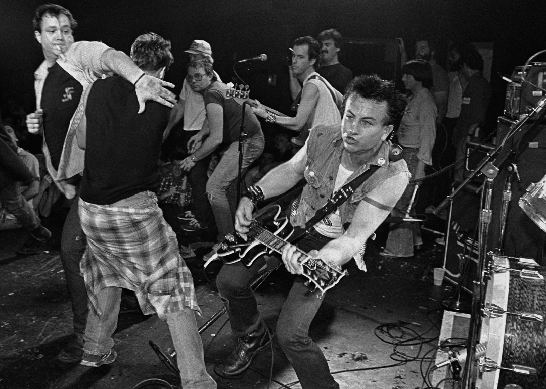 Fans join band onstage at at 1982 Fear concert.