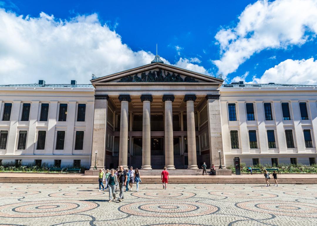 Students walking on the University of Oslo campus.