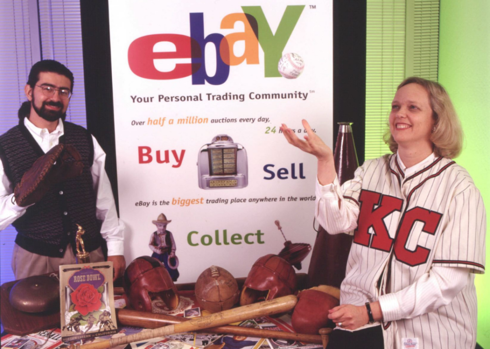 Pierre Omidyar and Meg Whitman pose with ebay goods