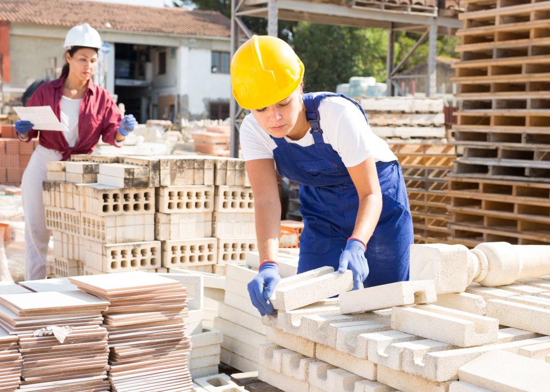 Two female workers in building materials production.