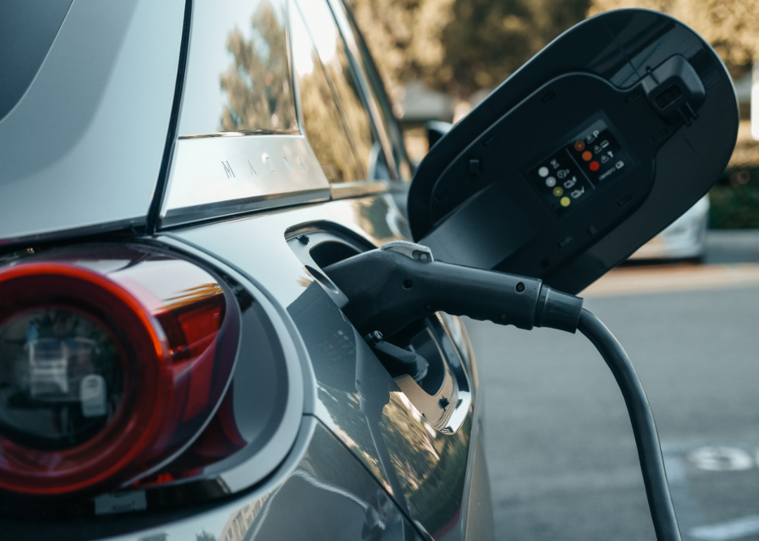 Closeup electric car charging.