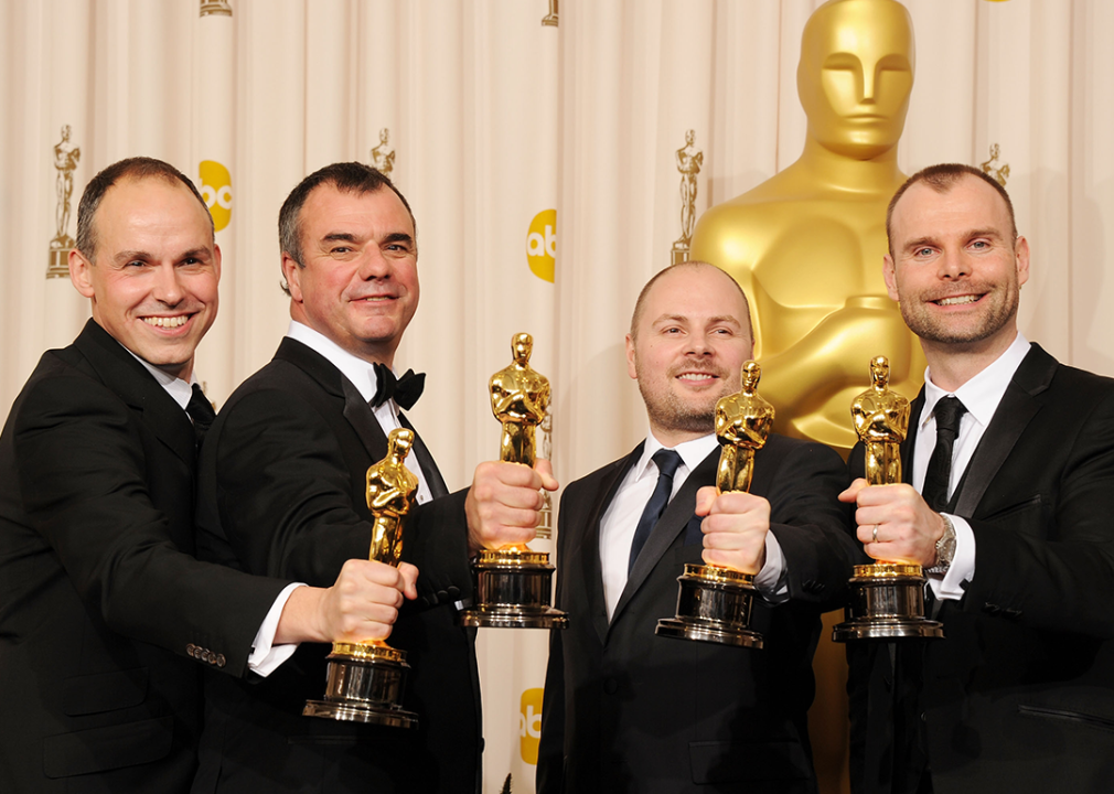 Paul Franklin, Chris Corbould, Andrew Lockley, and Peter Bebb pose with award for Best Visual Effects for ‘Inception'.