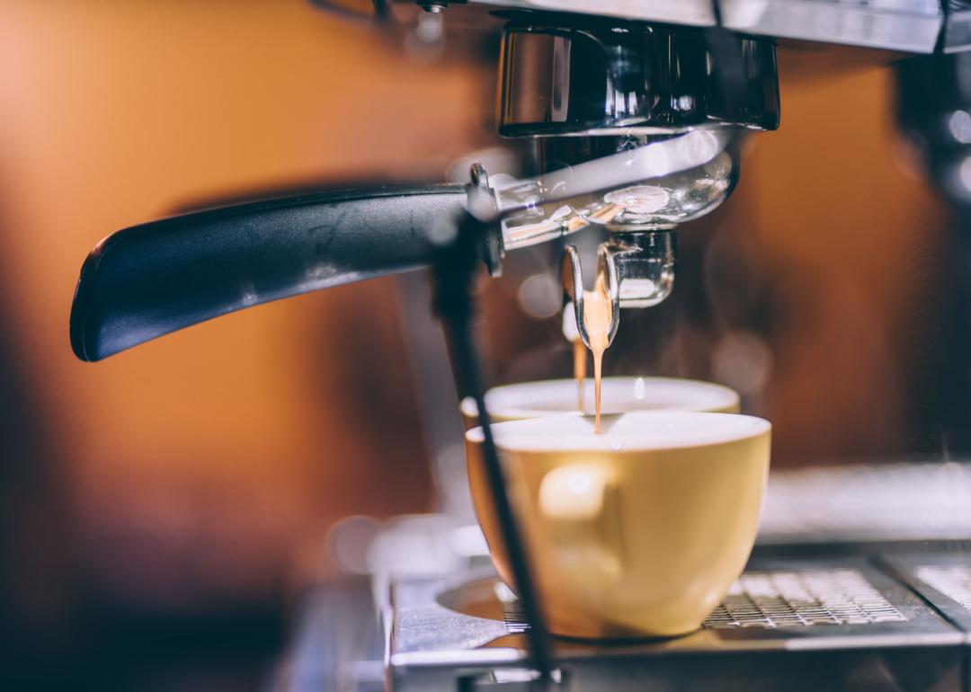 Detail of espresso machine brewing drinks.