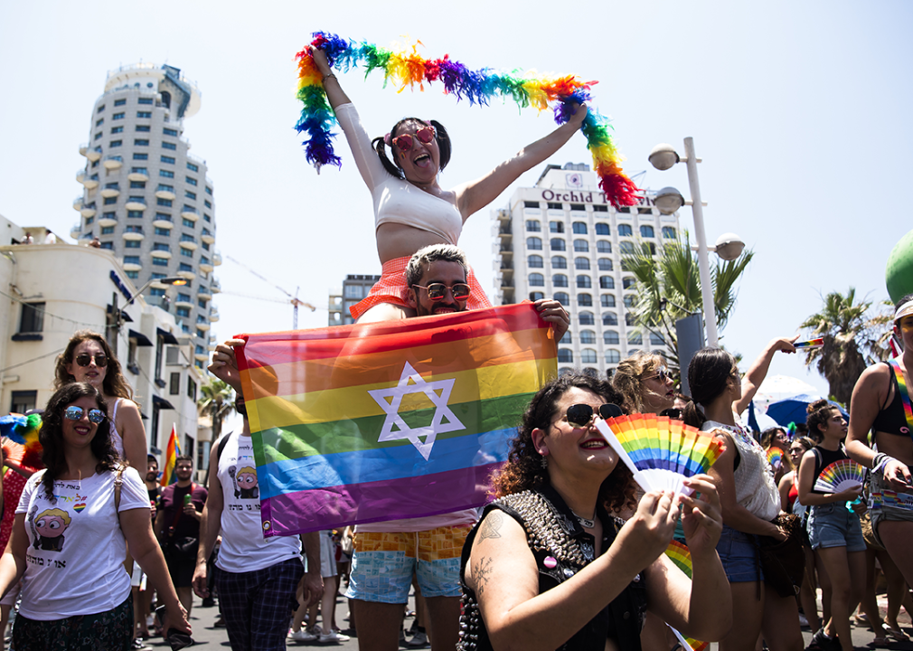 Revelers take part in the Tel Aviv Pride Parade.