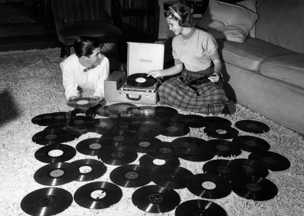 Teenage couple with with records.