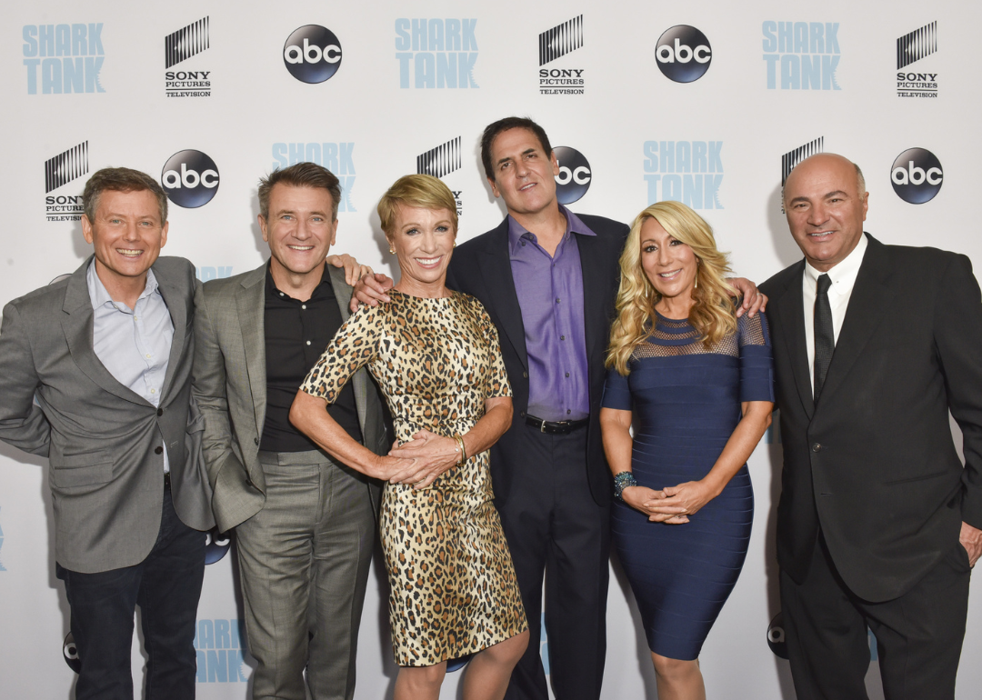 Shark Tank stars pose together at a premiere.